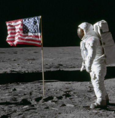 photo of astronaut in space with American flag 